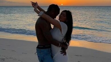 Photo of Kylie Jenner wraps her arms around a shirtless Travis Scott in romantic seaside snaps… as the rapper plots career comeback six months after Astroworld tragedy left 10 dead